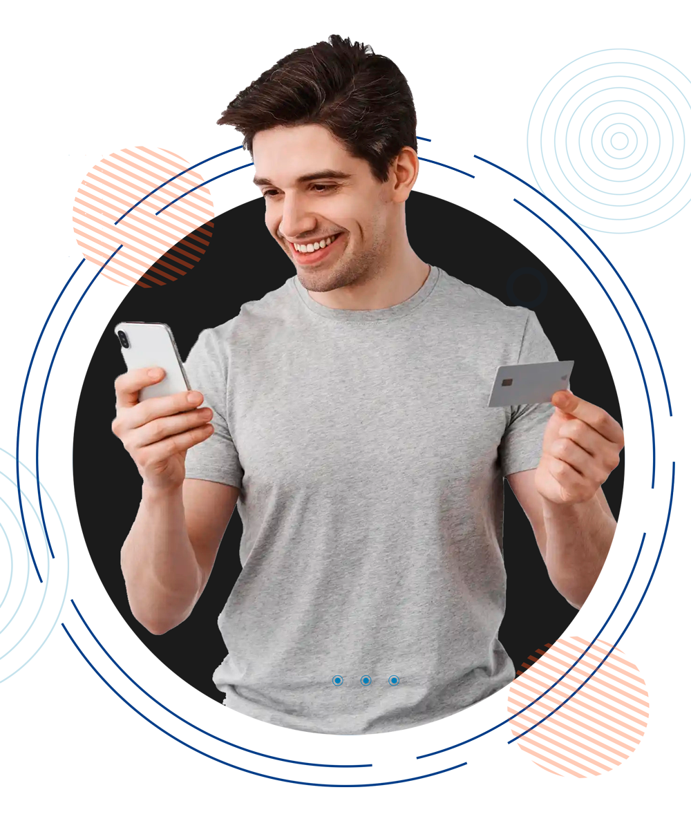 A man holding his Phone and Credit card